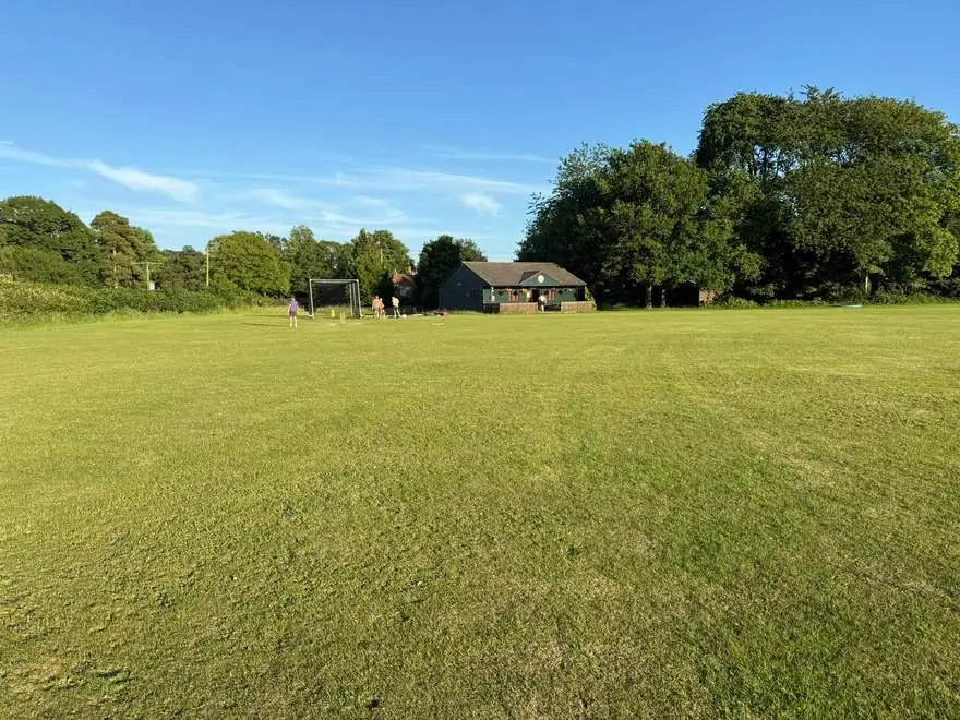 Evening sunshine over the outfield, practice net and pavilion at the Field of Dreams