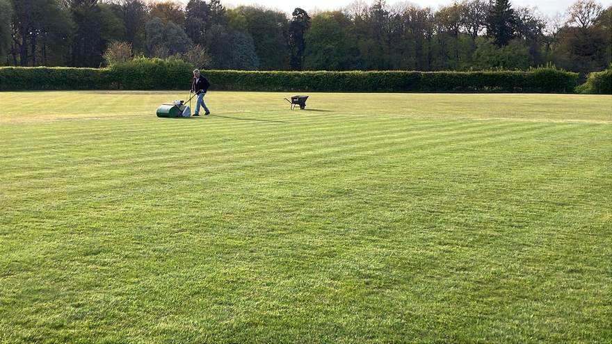 Freshly mown stripes on the outfield, with Clive and his mower at work