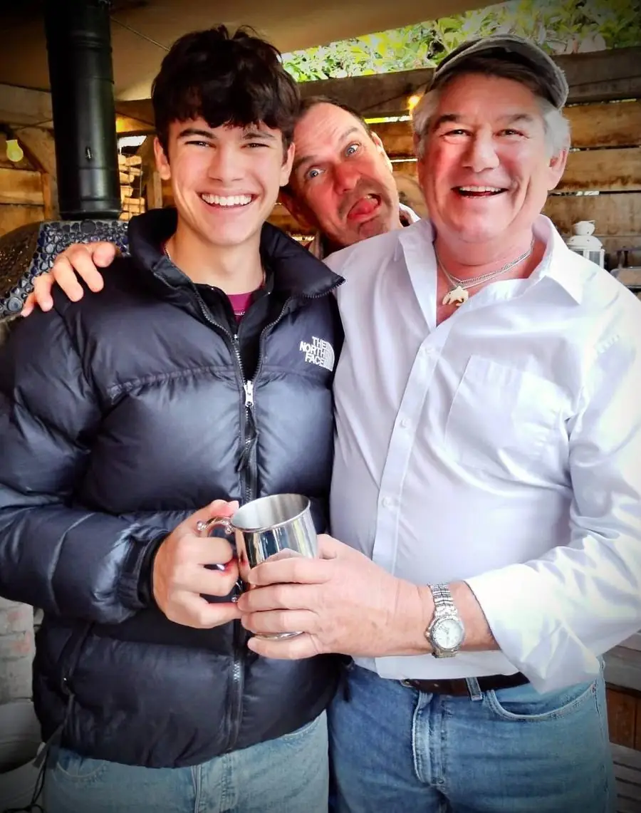 A pewter tankard presentation with a delighted photobomb in the background